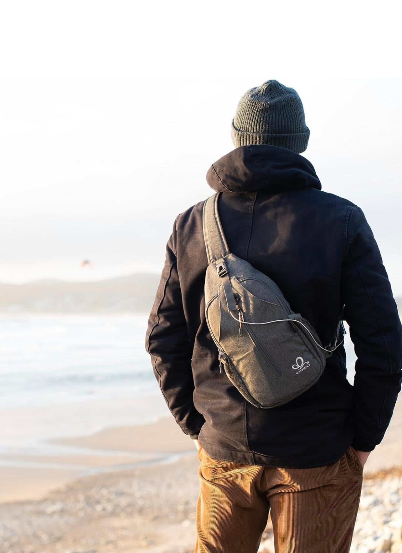 WATERFLY Crossbody Sling Backpack – Travel & Hiking Daypack (Black)